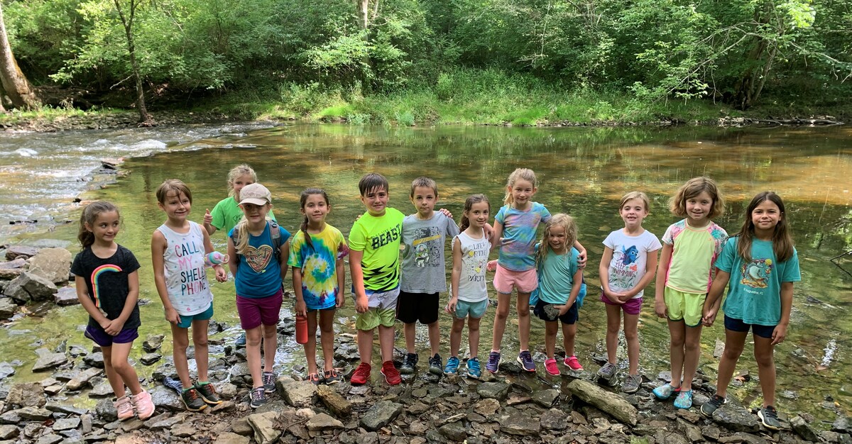 Campers at the river at Sycamore Park